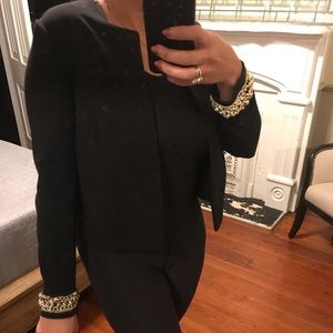 Black blazer embellished with gold chain
